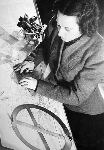 A woman using navigation instruments. A woman using navigation instruments.