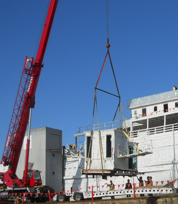 The pilothouse is set on the truck bed.