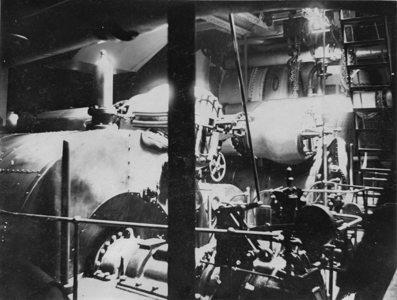 Interior view of a steam ship engine room.