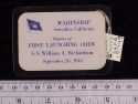 Rectangular white card printed in blue, encapsulated in clear plastic, with a safety pin on the back; for a "Member of/FIRST LAUNCHING CREW" at "MARINSHIP/ Sausalito, California" for the liberty ship "William A. Richardson" on 26 Sept. 1942.