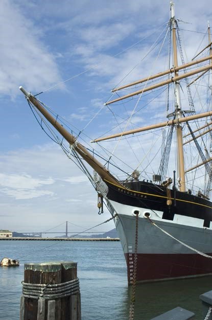 The bowsprint and bow section of BALCLUTHA with the Golden Gate Bridge in the background.