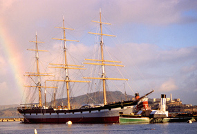 The majestic three-masted historic ship BALCLUTHA with a rainbow off her aft port quarter. The majestic three-masted historic ship BALCLUTHA with a rainbow off her aft port quarter.