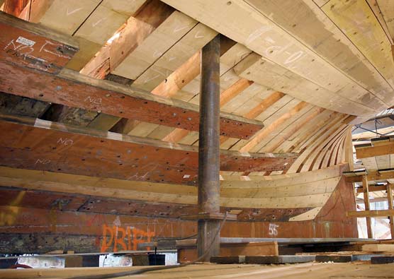 The massive outer hull of the Thayer with new and old planking.