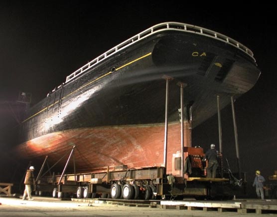 Thayer out of the water and being rolled to a former seaplane hangar.