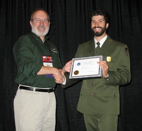 Park Ranger Chris Poissant accepting the award for the park.