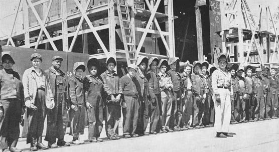 A gang of welders at the Marinship yard around 1943. The woman in front is Kay Daws. Daws was a former buyer in a dress shop who became a foreman.
