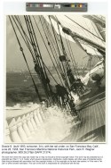 Black and white photo from the deck, looking towards the bow, with San Francisco in the background