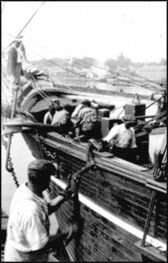 Black seamen on the deck of a whaling bark.