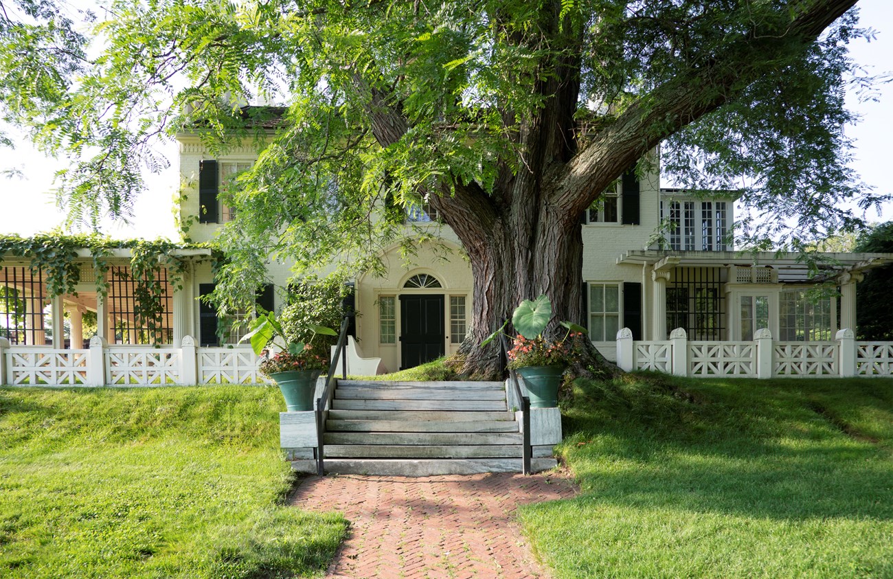 brick pathway leading to historic house