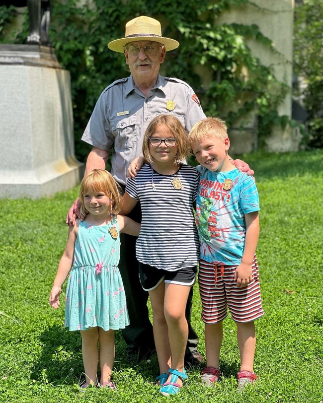 ranger with three junior rangers