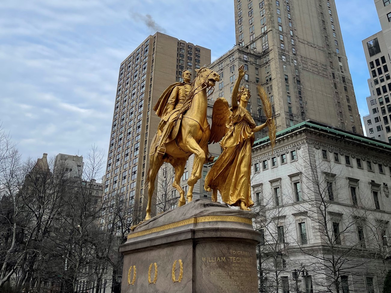 Sherman Memorial gold-colored statue of angel and man on a horse