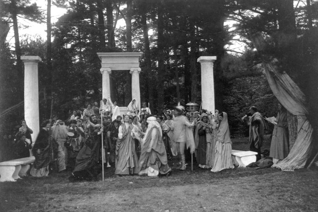 The Masque black and white photo of group dressed in classical-inspired costumes
