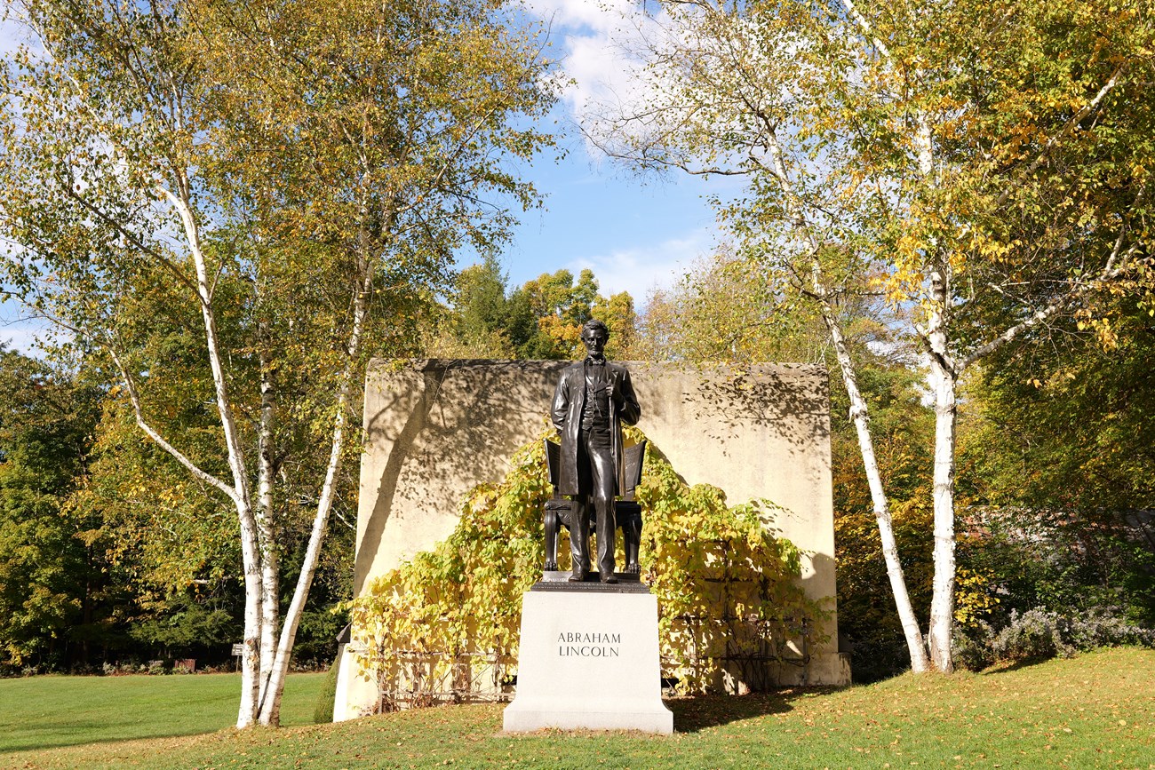 Standing Lincoln in fall