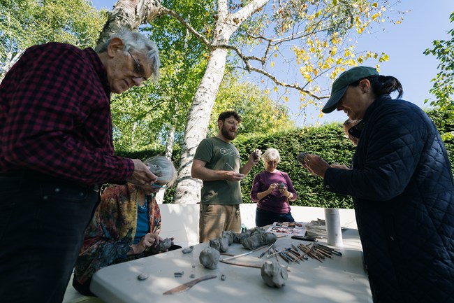 people making art from clay
