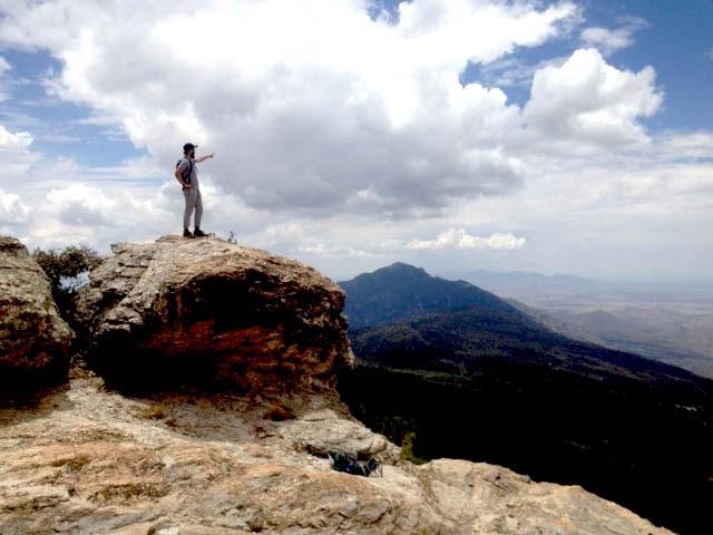 In the Rincons Youth pointing out over the Rincon Mountains