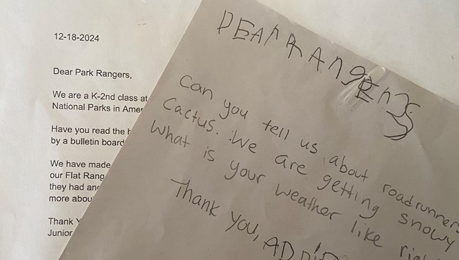 handwritten note from a child to "Dear Rangers" laid on top of a type-written letter from a teacher