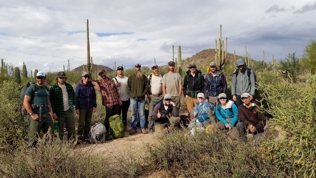 Group photo of the trail crew out in the field after finishing a plot