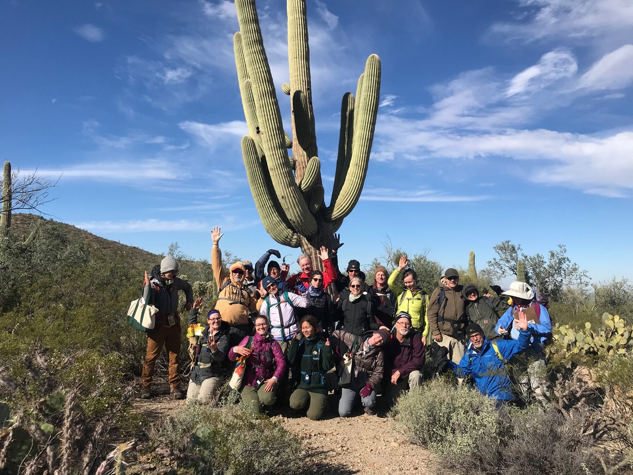 Tucson Mountain Hiking group photo saguaro pose