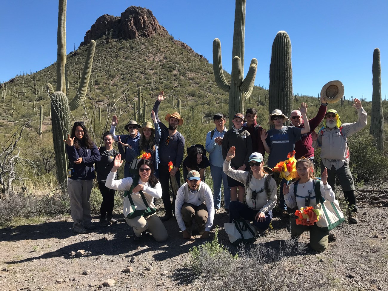 Volunteer group photo saguaro pose