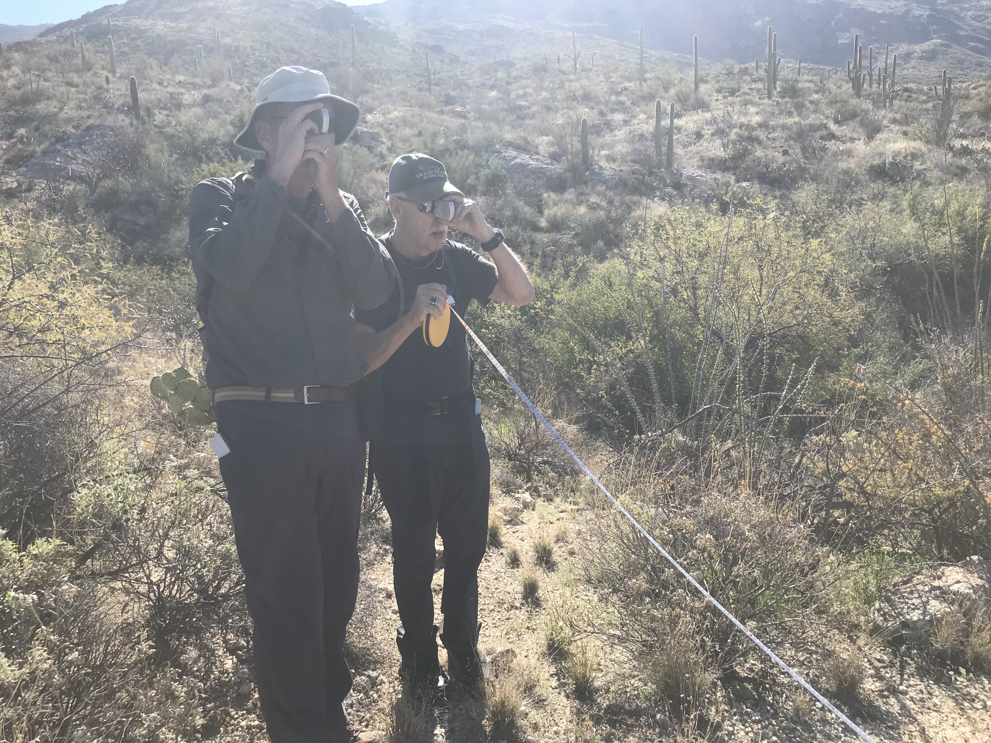 Volunteers using a clinometer.