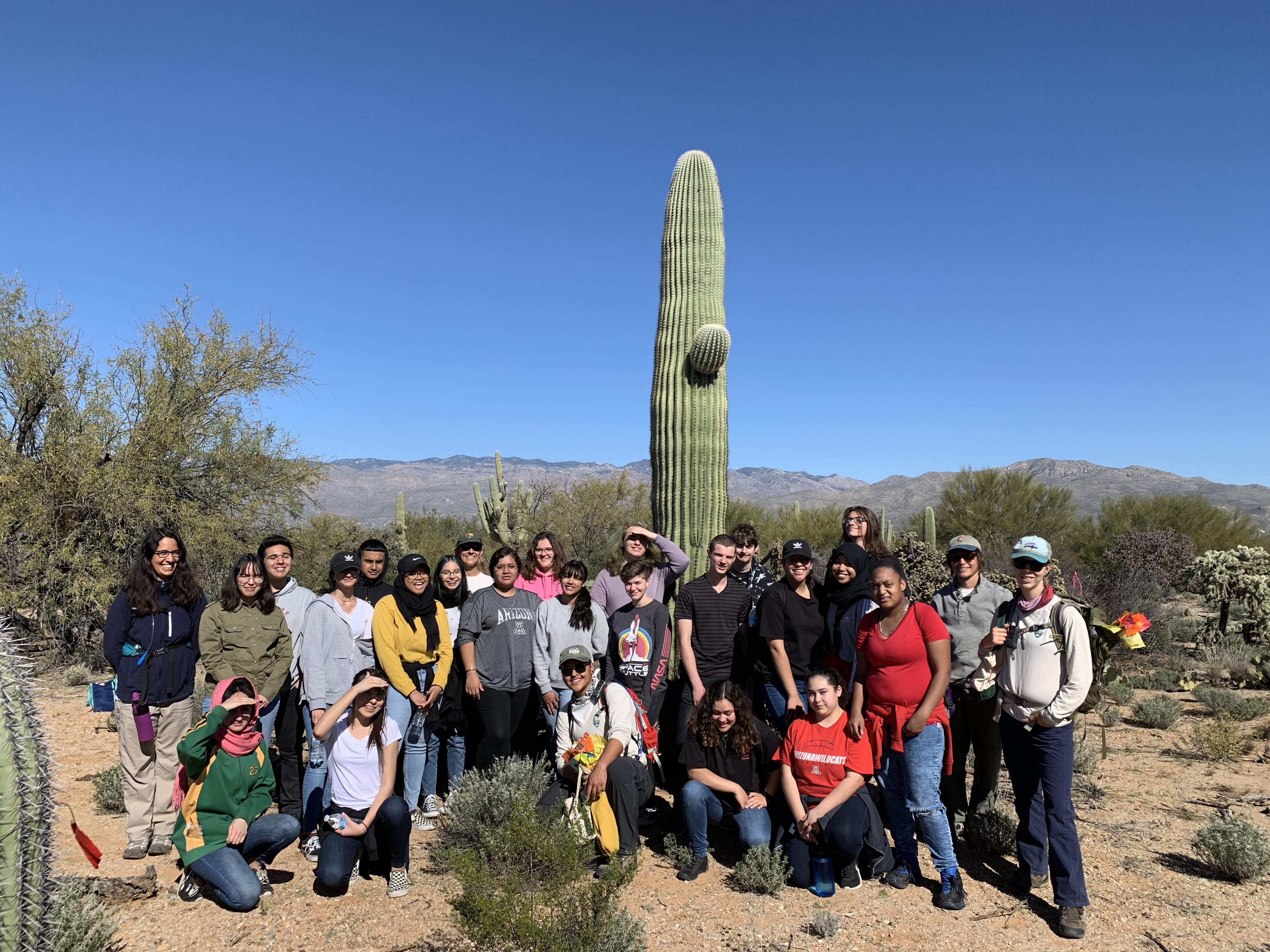 Students and park staff smiling for a photo after the census.