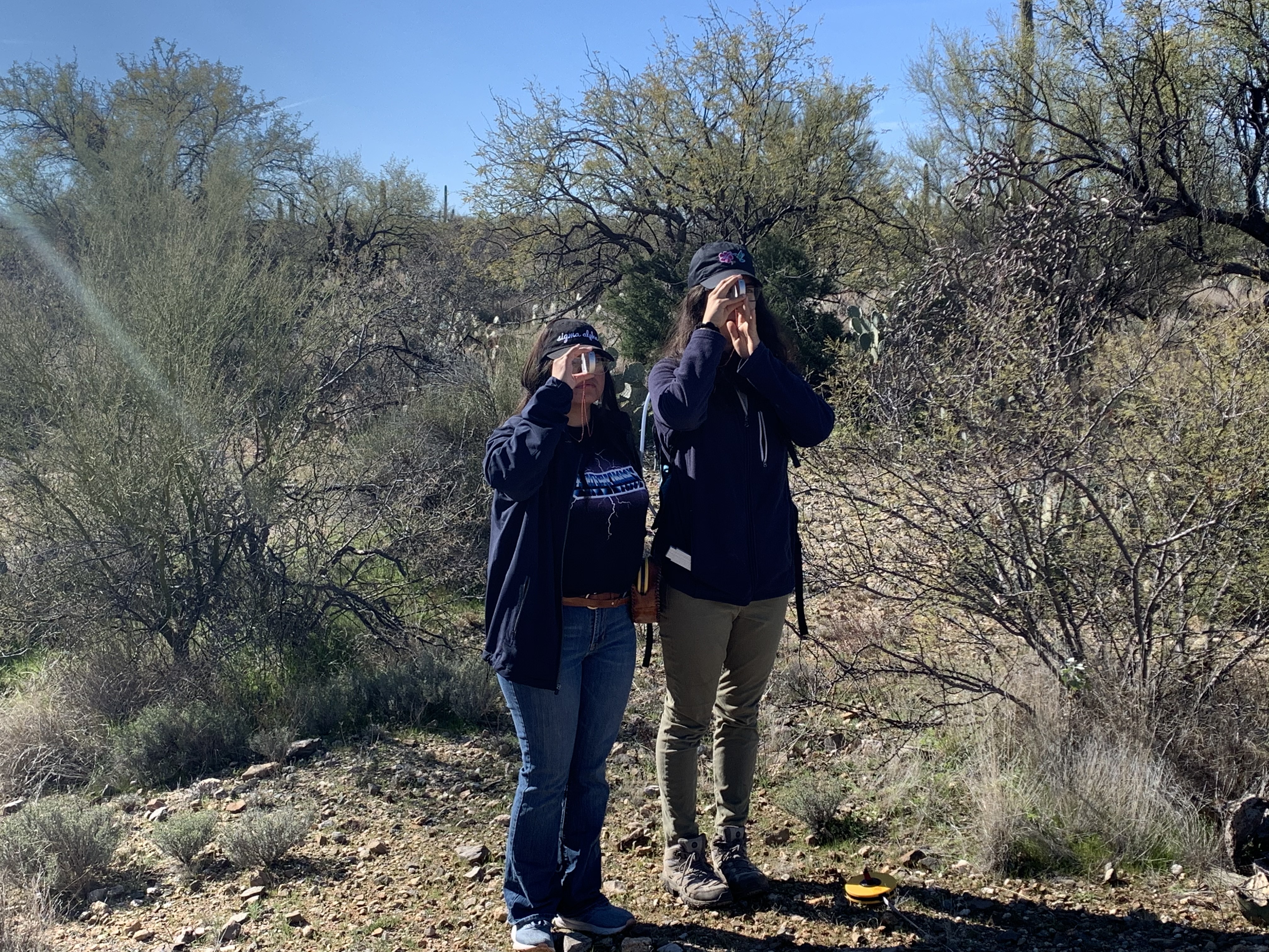 Students take measurements using clinometer