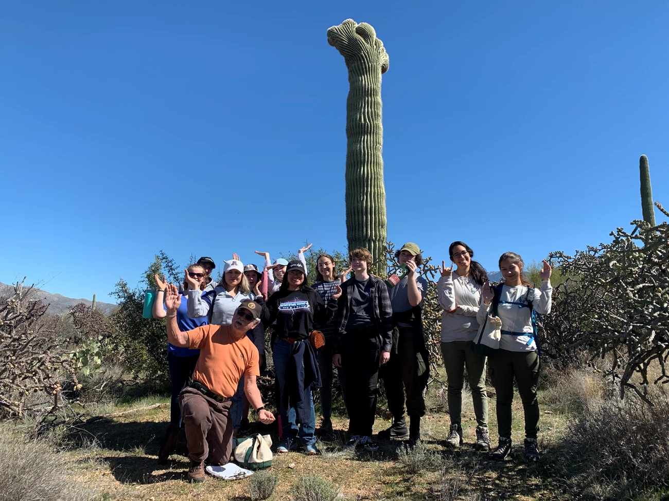 Biodiversity class group photo saguaro pose Biodiversity class group photo saguaro pose