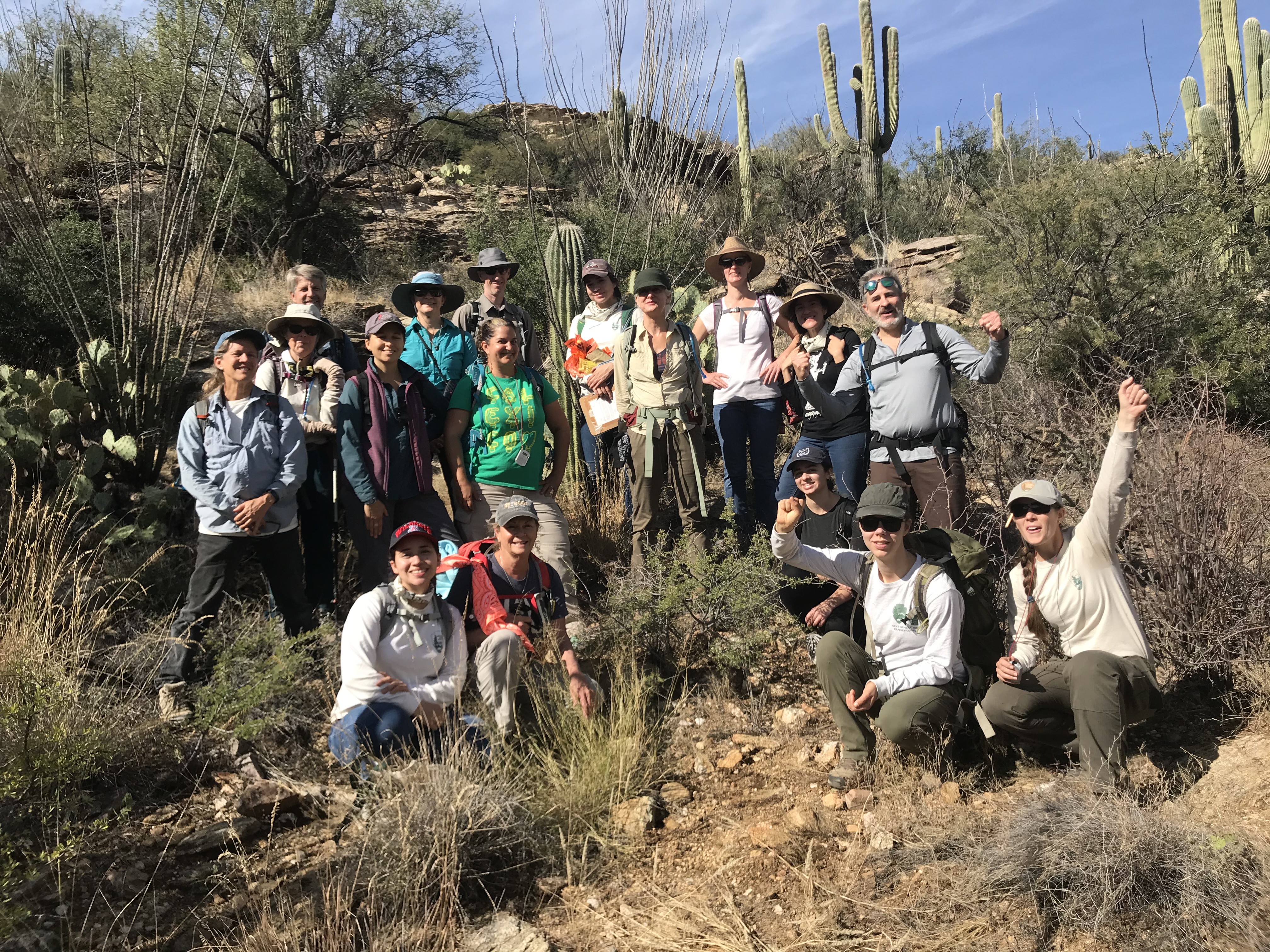 A group photo of volunteers out in the field after the survey