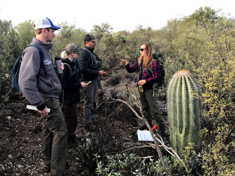 A woman explaining to her group the logistics of the census