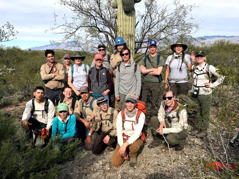 Park Staff group photo after the census. Behind them is a tall saguaro with its nurse tree.