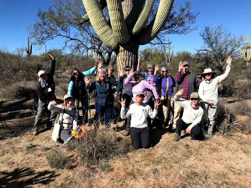 Park staffs and volunteers group photo People posing like a saguaro