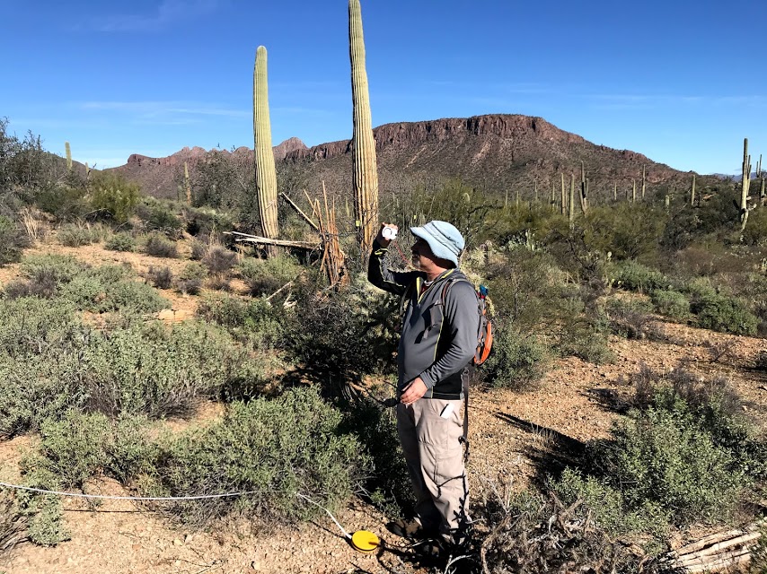 A man using a clinometer.