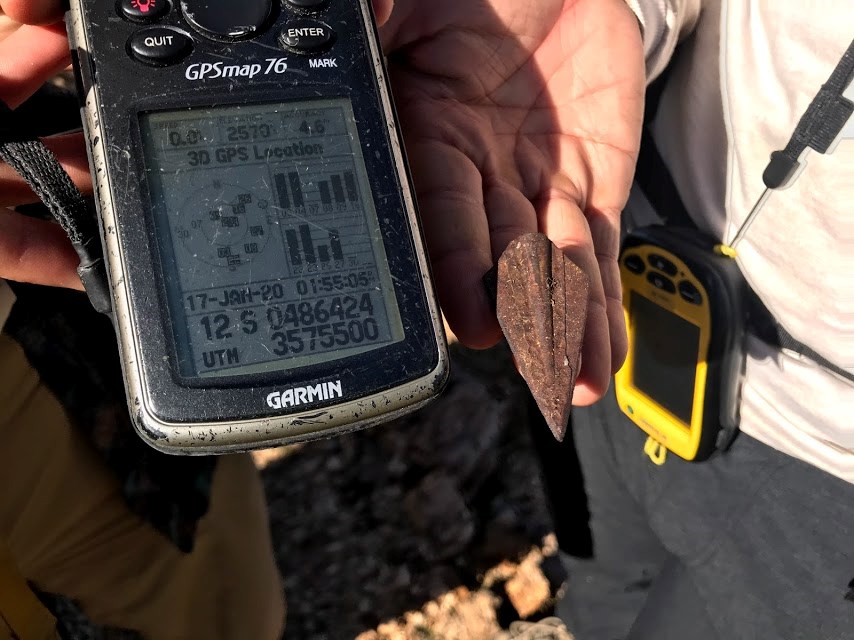 GPS device next to an arrowhead