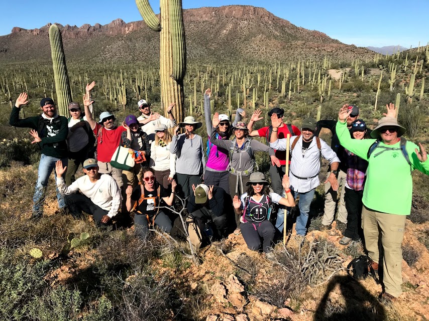 Group photo on the plot after the census. People are posing like a saguaro.