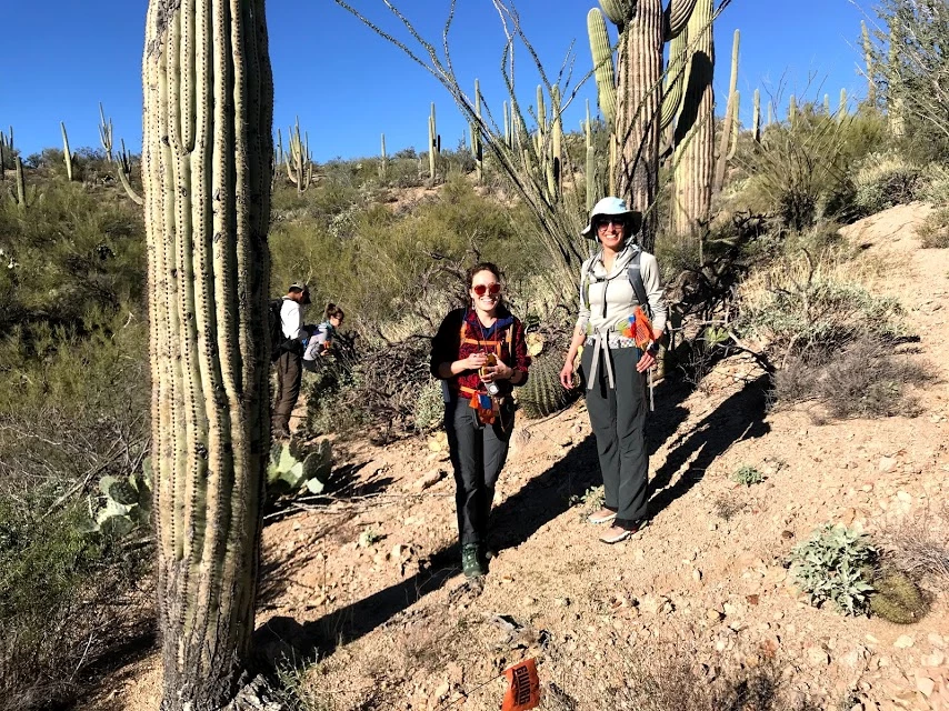 Adventure Scientists Two women on the plot smiling.