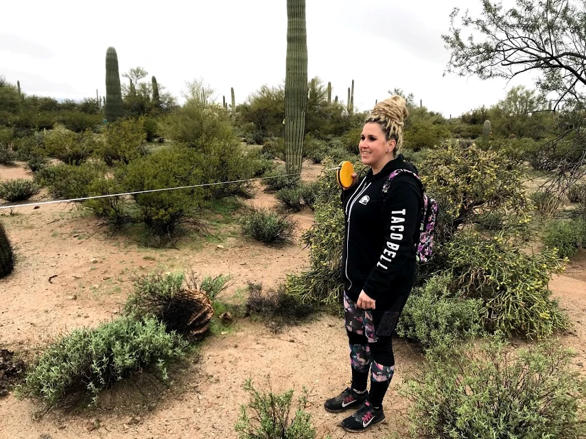 Individual volunteer A woman holding the other end of a measuring tape.