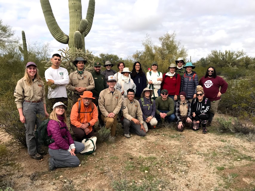 Group of volunteers and park staff smiling.