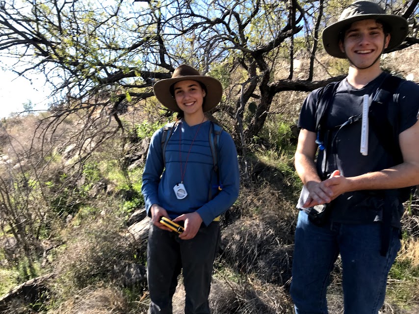A young man and woman smiling.