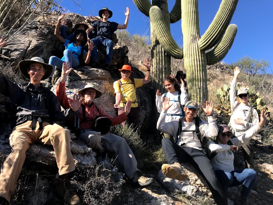 Group of volunteers posing like a saguaro.