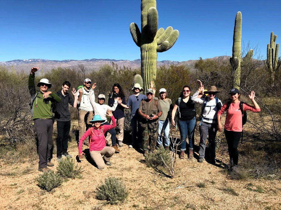 Individual Volunteers and Park Staff Volunteers and park staff posing like a saguaro.