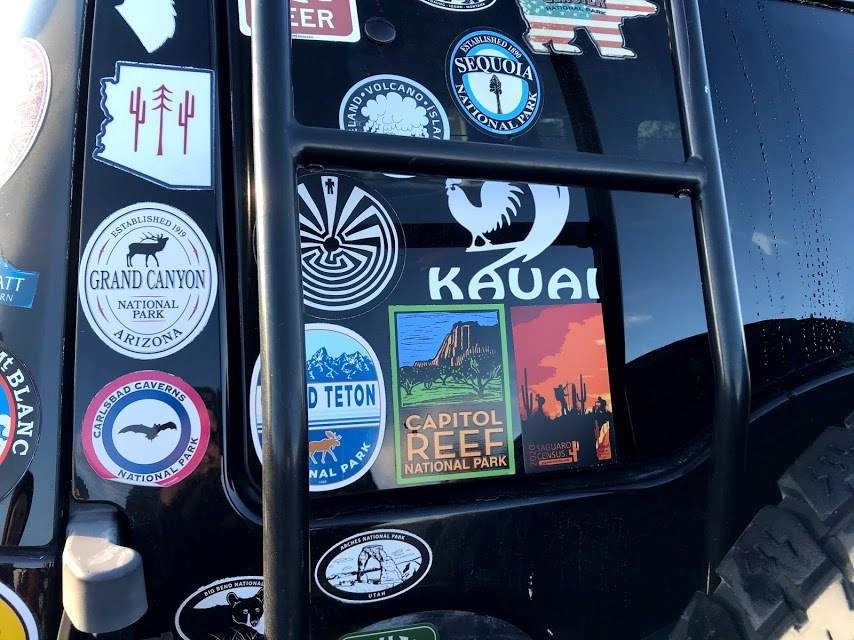 Back of a jeep with a saguaro census 2020 sticker.