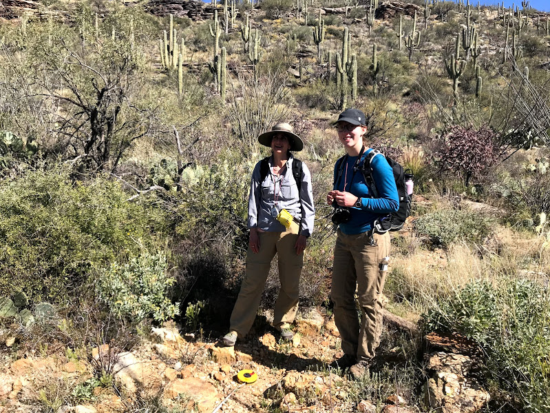 Adventure Scientists smile in the desert
