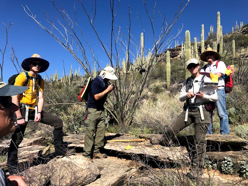 Adventure Scientists and park staff in desert landscape