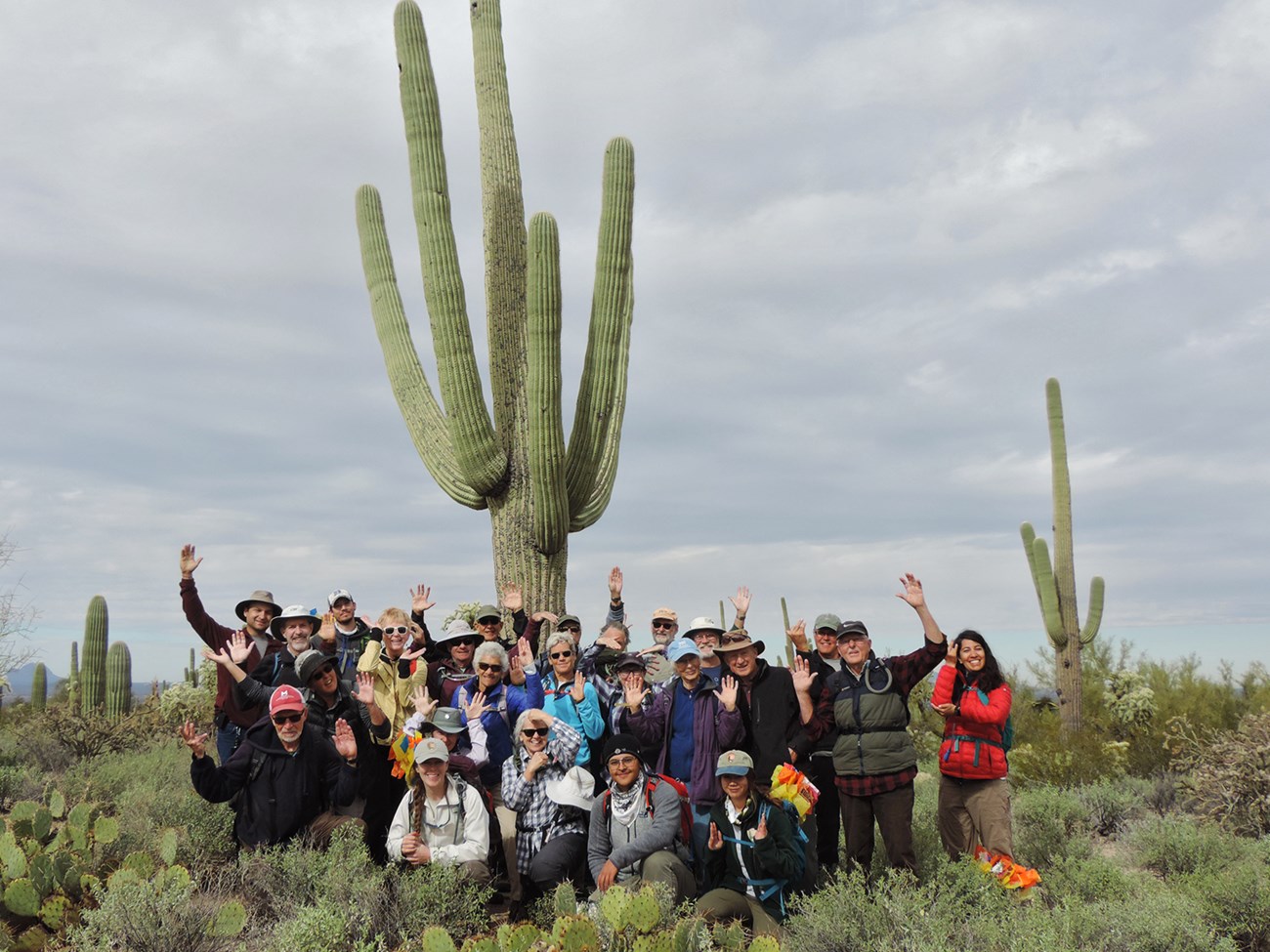 Volunteers posing like a saguaro.