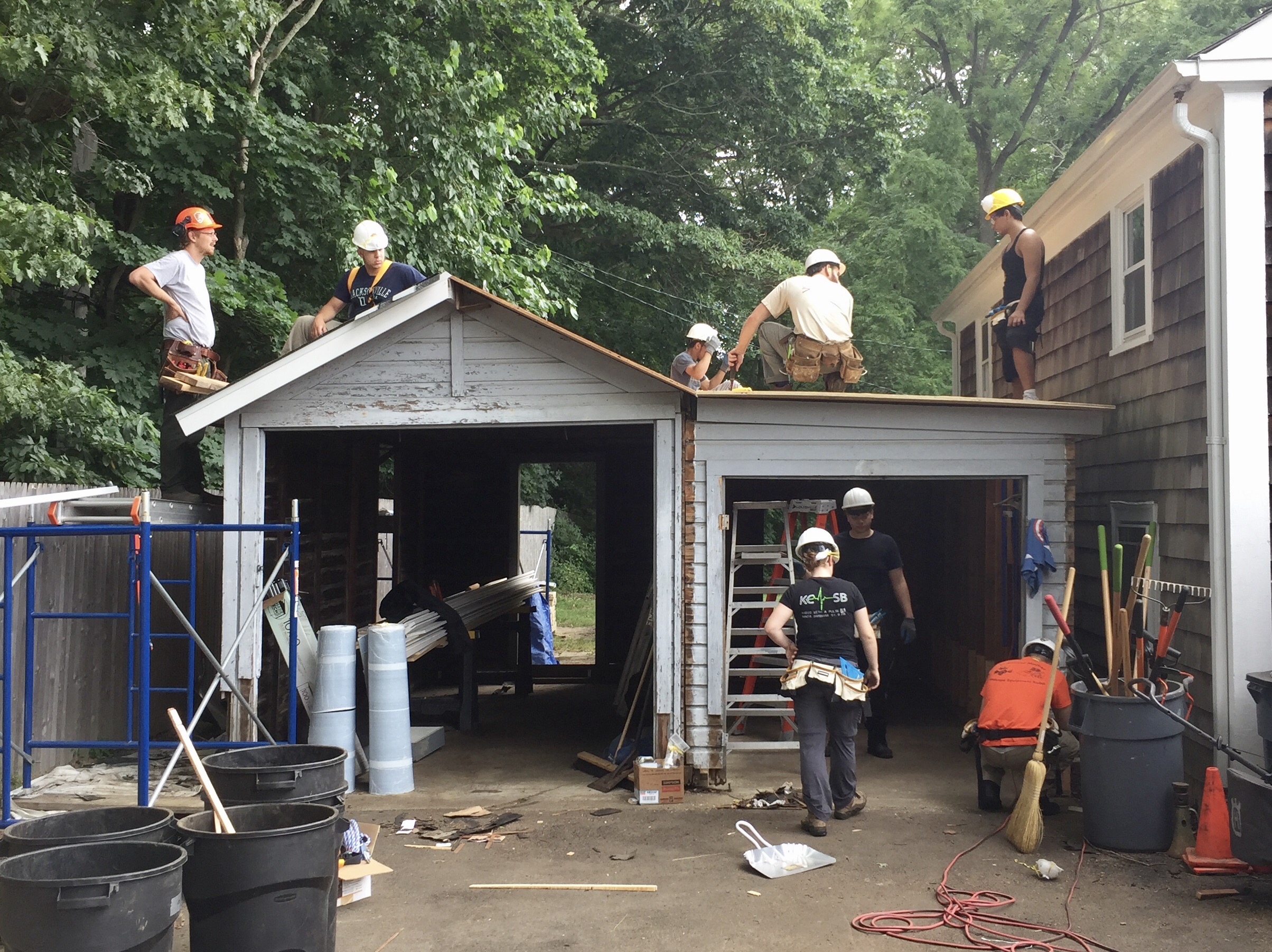 Students working on historic shed.