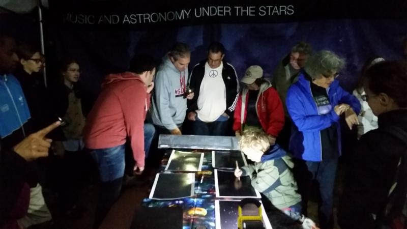 Visitors, astronomers, and park rangers exploring the night sky. NPS Photo