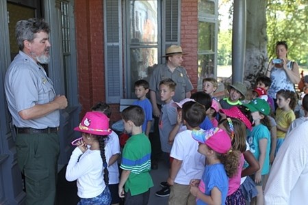Students listening to a ranger on the porch of Sagamore Hill. Students listening to a ranger on the porch of Sagamore Hill.