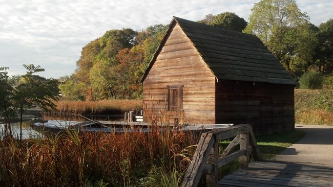 A building next to a dock alongside the Saugus River. A building next to a dock alongside the Saugus River.