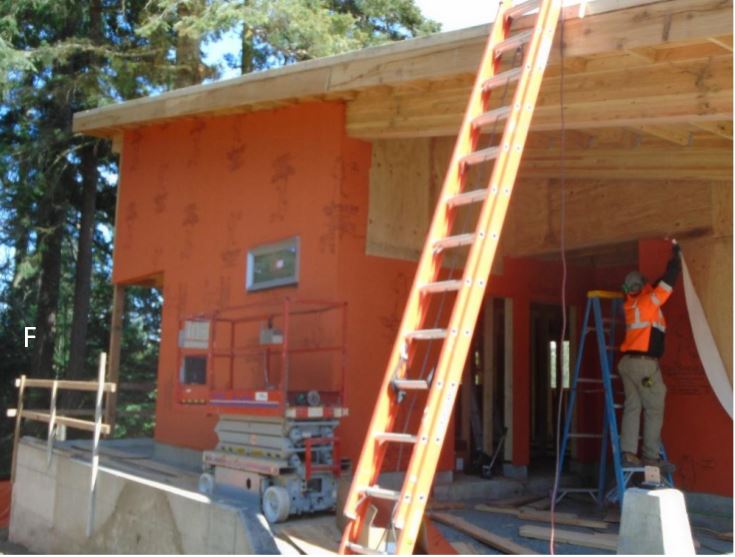 WRB instalation Orange WRB building wrap being installed