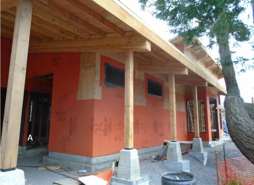 Wrapping Continues Front elevation showing wrapping and flashing installation continuing